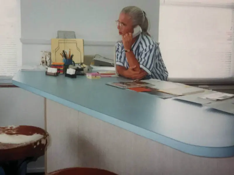 Olske Forbes at the front desk of Ironsidepress